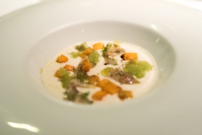 Cured fish with almond cream and sea urchin at Restaurant Santi Taura